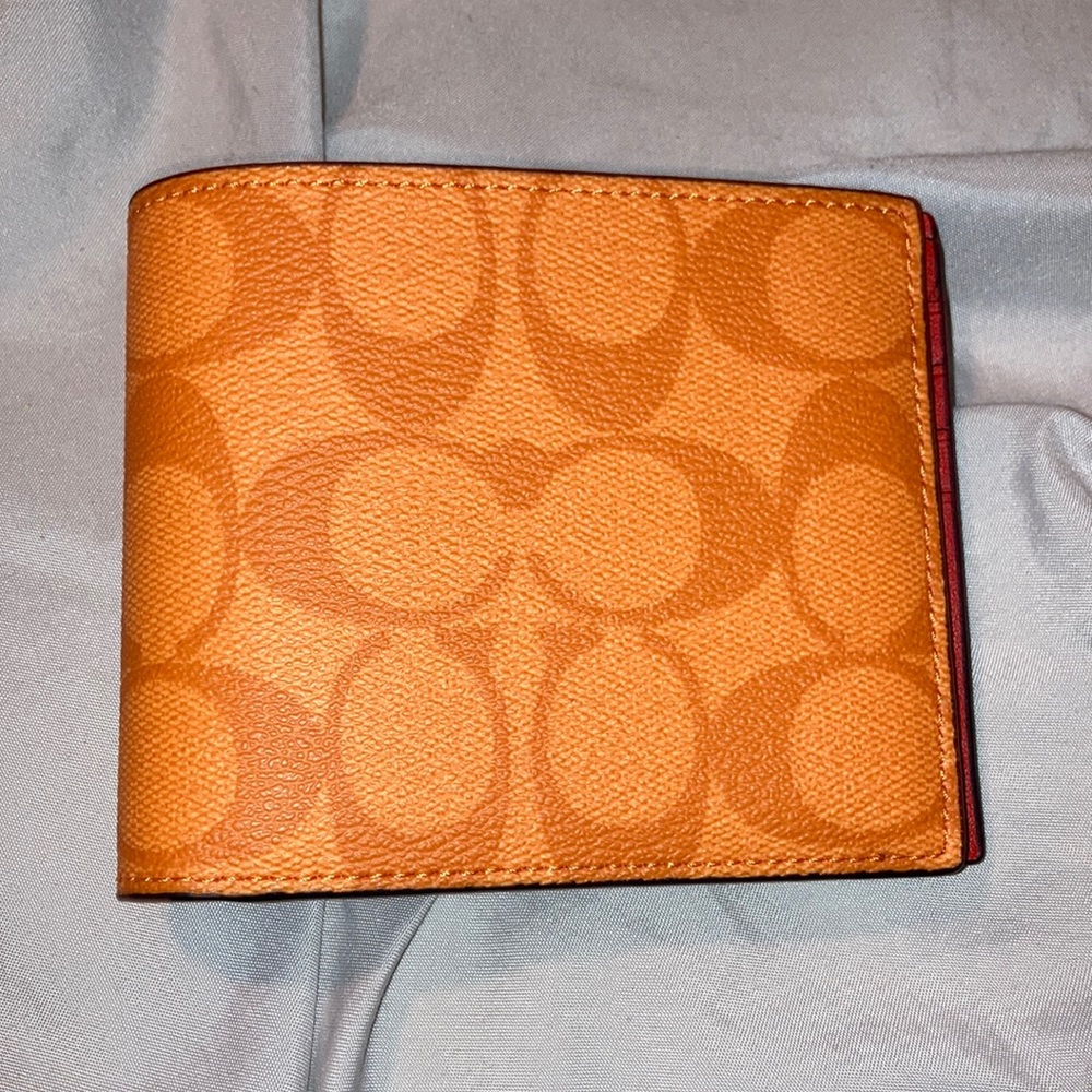 Selling my orange coach wallet